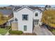 Stunning modern farmhouse exterior with a stone accent, patio, and well-manicured lawn at 3718 E Sells Dr, Phoenix, AZ 85018