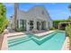 Beautiful backyard pool with outdoor seating and a modern farmhouse exterior at 3718 E Sells Dr, Phoenix, AZ 85018