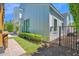 Charming modern farmhouse exterior with a well-maintained lawn, pathway, and fenced yard at 3718 E Sells Dr, Phoenix, AZ 85018