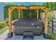 Close up of Backyard hot tub with a pergola, creating a private and relaxing retreat at 3718 E Sells Dr, Phoenix, AZ 85018