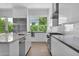 Contemporary kitchen featuring white cabinets, stainless appliances, and sleek countertops at 3718 E Sells Dr, Phoenix, AZ 85018
