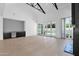 Open-concept living area with wet bar, floor-to-ceiling windows, and access to outdoor living at 3718 E Sells Dr, Phoenix, AZ 85018