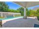 Stunning pool area with a water feature, patio, and lush landscaping at 3718 E Sells Dr, Phoenix, AZ 85018