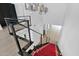 Modern staircase with metal railing and a red runner at 3718 E Sells Dr, Phoenix, AZ 85018