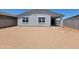 A large, empty backyard ready for landscaping with block wall and covered patio at 3805 N Camden Dr, Florence, AZ 85132