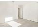 Cozy bedroom featuring carpet, neutral walls, a closet, and an adjoining room at 3805 N Camden Dr, Florence, AZ 85132