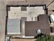 An aerial view shows the layout of the property, roofing, and fenced in yard at 404 E Centre Ave, Buckeye, AZ 85326