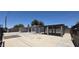 Spacious backyard featuring a large parking area, carport, and block fencing at 404 E Centre Ave, Buckeye, AZ 85326