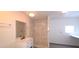 Modern bathroom featuring a marble tiled shower, sleek vanity, and updated fixtures at 404 E Centre Ave, Buckeye, AZ 85326