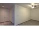 Bedroom with neutral paint, ceiling fan, and wood look tile flooring with convenient access to two doorways at 404 E Centre Ave, Buckeye, AZ 85326