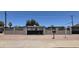 Exterior shot of a fenced in home with a spacious gate at 404 E Centre Ave, Buckeye, AZ 85326