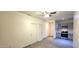 Living room leading to the kitchen with stainless steel appliances at 404 E Centre Ave, Buckeye, AZ 85326