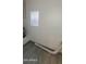 The utility room features modern flooring, a small window, and essential home systems at 404 E Centre Ave, Buckeye, AZ 85326