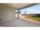 Covered back patio that looks out to a basketball court and putting green at 4143 E Sidesaddle Rd, San Tan Valley, AZ 85140