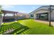 Backyard featuring putting green, basketball court, and pergola covered hot tub at 4143 E Sidesaddle Rd, San Tan Valley, AZ 85140