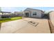 Backyard featuring basketball court, covered patio, and putting green with hot tub at 4143 E Sidesaddle Rd, San Tan Valley, AZ 85140
