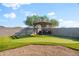 Backyard with putting green, sand trap, hot tub with wooden pergola at 4143 E Sidesaddle Rd, San Tan Valley, AZ 85140