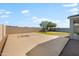 Spacious backyard featuring a concrete basketball court, lush green grass and shaded pergola at 4143 E Sidesaddle Rd, San Tan Valley, AZ 85140