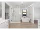 Bright bathroom with a soaking tub, glass enclosed shower, and ample counter space at 4143 E Sidesaddle Rd, San Tan Valley, AZ 85140