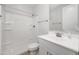 This bathroom features a shower, white cabinets and countertops, with chrome fixtures at 4143 E Sidesaddle Rd, San Tan Valley, AZ 85140