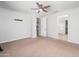 Spacious bedroom with a ceiling fan, carpet floors, and neutral walls at 4143 E Sidesaddle Rd, San Tan Valley, AZ 85140
