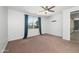 Bedroom featuring carpet floors, ceiling fan, and plenty of natural light at 4143 E Sidesaddle Rd, San Tan Valley, AZ 85140