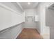 Spacious walk-in closet with shelving and racks for optimal organization and an ensuite bathroom at 4143 E Sidesaddle Rd, San Tan Valley, AZ 85140