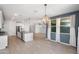 Open-concept kitchen and dining room with granite countertops and ample space at 4143 E Sidesaddle Rd, San Tan Valley, AZ 85140
