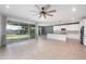 Spacious living area flows into a modern kitchen, featuring sliding doors to a well-kept backyard at 4143 E Sidesaddle Rd, San Tan Valley, AZ 85140