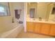 Bright bathroom featuring a soaking tub, double vanity, and ample counter space at 639 E Palo Verde St, Casa Grande, AZ 85122