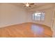 A bright and airy bedroom with wood laminate flooring and a ceiling fan at 639 E Palo Verde St, Casa Grande, AZ 85122