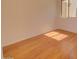 A bedroom featuring wood laminate flooring and a sunlit window at 639 E Palo Verde St, Casa Grande, AZ 85122