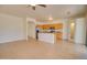 Open concept living/kitchen space with tile floors, wood cabinets, granite counters and stainless appliances at 639 E Palo Verde St, Casa Grande, AZ 85122