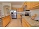 The kitchen is equipped with stainless steel appliances, granite countertops, and wood cabinetry at 639 E Palo Verde St, Casa Grande, AZ 85122