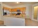 Kitchen features granite countertops, tile floors, stainless steel appliances and wood cabinets at 639 E Palo Verde St, Casa Grande, AZ 85122