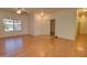 This open-concept living room has wood floors, neutral paint, ceiling fans, and plenty of natural light at 639 E Palo Verde St, Casa Grande, AZ 85122