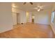 A spacious living room features wood floors, neutral paint, ceiling fans and lots of natural light at 639 E Palo Verde St, Casa Grande, AZ 85122