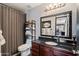 Bathroom with dark wood cabinets and modern fixtures at 671 W Jahns Ct, Casa Grande, AZ 85122