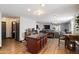 Open-concept living space with island and wood flooring at 671 W Jahns Ct, Casa Grande, AZ 85122