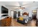 Bedroom featuring natural lighting, wood-look floors, and modern decor at 671 W Jahns Ct, Casa Grande, AZ 85122