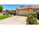 Front exterior highlighting a two-car garage and well-manicured landscaping at 7324 S Bonarden Ln, Tempe, AZ 85283