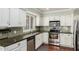 Bright kitchen features stainless steel appliances, tile backsplash, and countertops at 7324 S Bonarden Ln, Tempe, AZ 85283