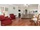 Spacious living room with hardwood floors, fireplace, and ample natural light at 7324 S Bonarden Ln, Tempe, AZ 85283