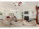 Inviting living room with a cozy fireplace, hardwood floors, and ample seating at 7324 S Bonarden Ln, Tempe, AZ 85283