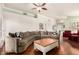 Expansive living room featuring a large sectional sofa and hardwood floors at 7324 S Bonarden Ln, Tempe, AZ 85283