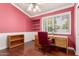 Bright office space with hardwood floors, window, closet and built-in shelving at 7324 S Bonarden Ln, Tempe, AZ 85283