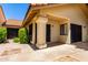 Charming covered patio with decorative columns, tiled flooring, and an inviting space for outdoor gatherings at 7324 S Bonarden Ln, Tempe, AZ 85283