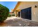 Covered patio with sliding glass doors for seamless indoor-outdoor living with lush greenery and a well-maintained backyard at 7324 S Bonarden Ln, Tempe, AZ 85283