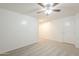 A bedroom with neutral carpet and trim is brightened by the white walls and door at 854 S San Marcos Bldg 6 -- # A, Apache Junction, AZ 85120