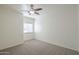 Neutral bedroom includes carpet and ceiling fan at 854 S San Marcos Bldg 6 -- # A, Apache Junction, AZ 85120